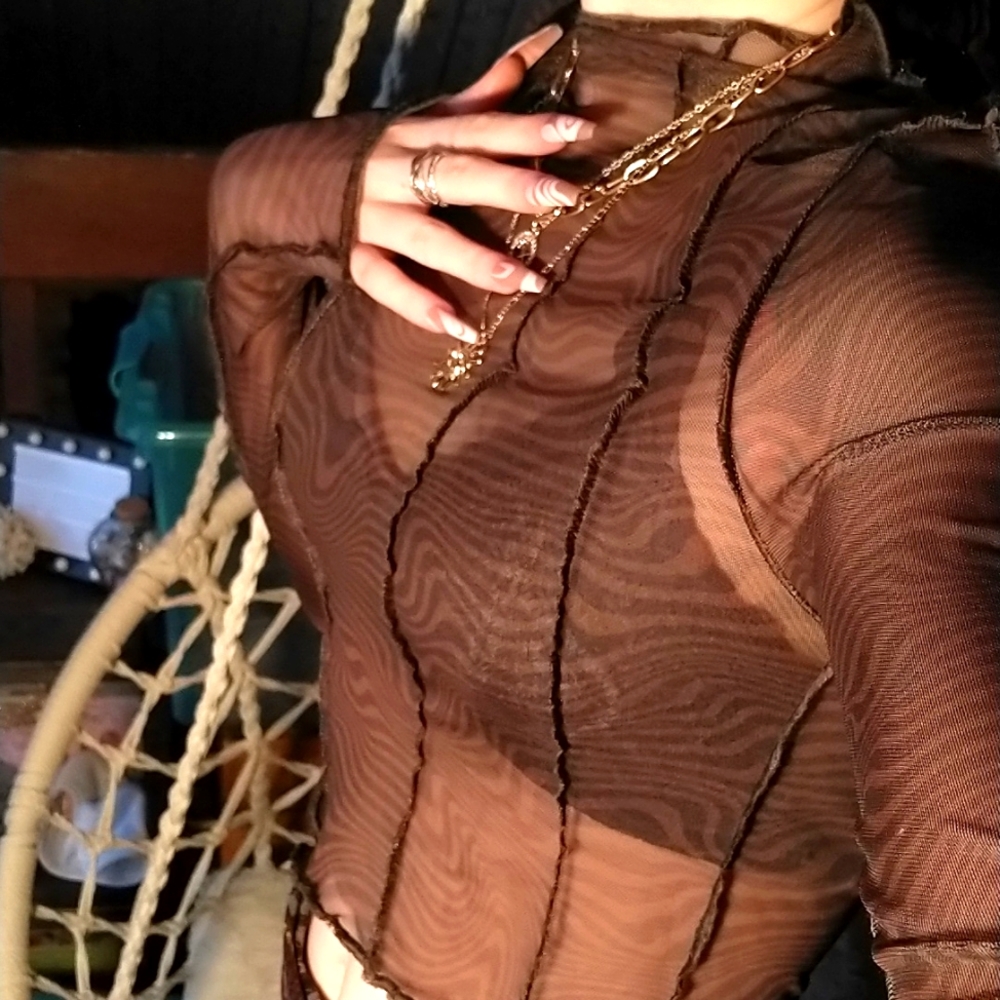 A mesh long sleeve crop top